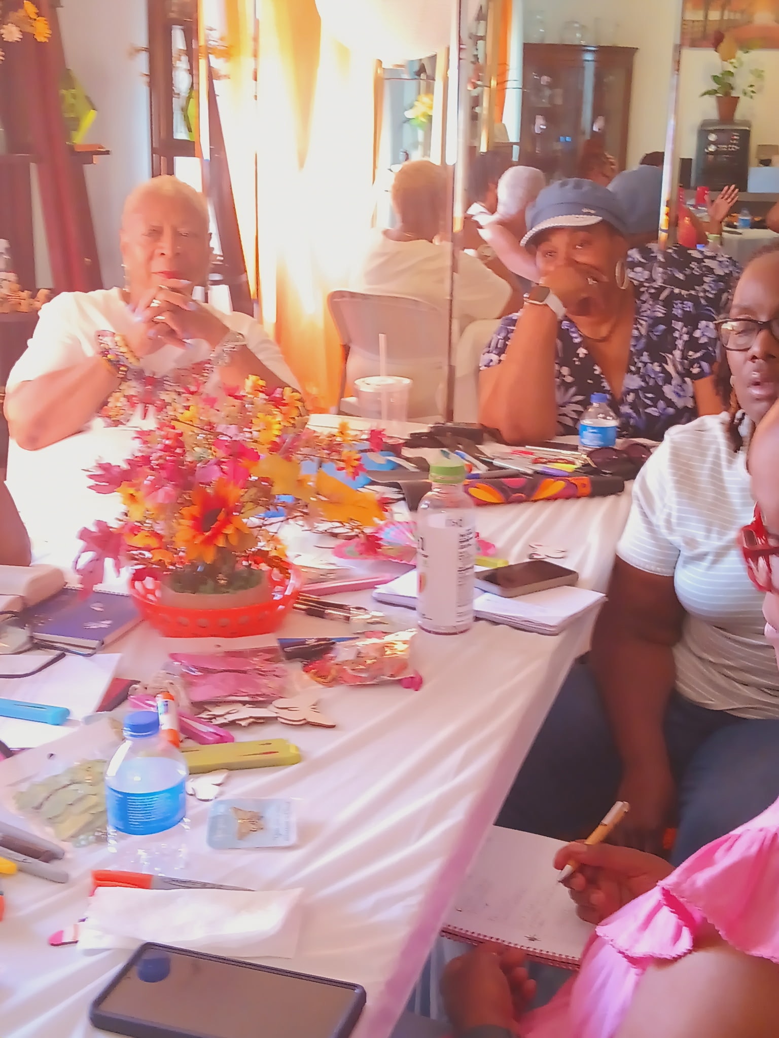 S.A.F.E. Sisters working together at a craft and activity table